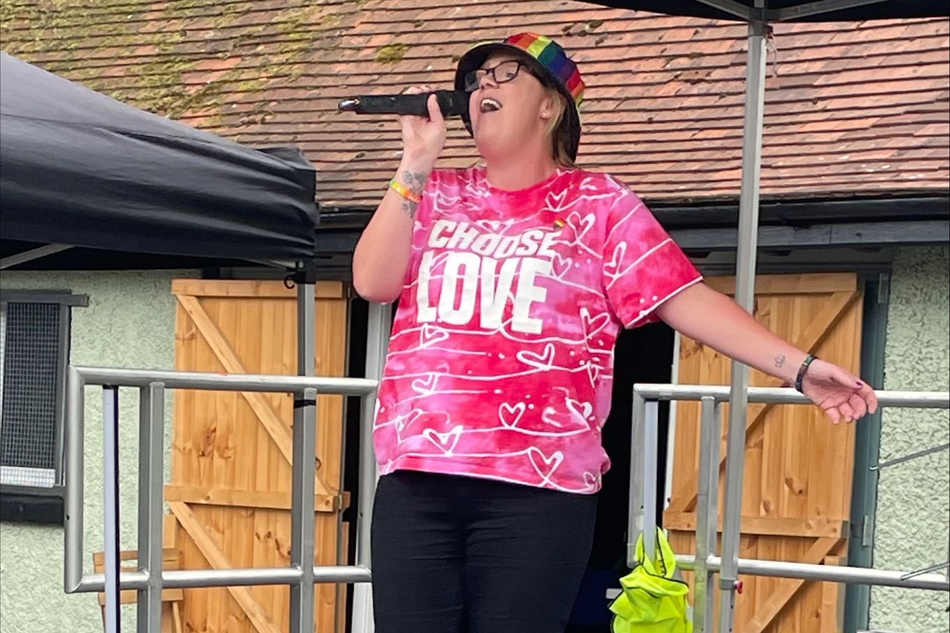 A singer performs on stage in a 'Choose Love' t-shirt A singer performs on stage in a 'Choose Love' t-shirt